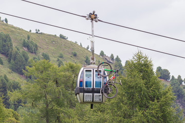 Ski lift cable booth or car with a mountainbike on the side (unmarked)