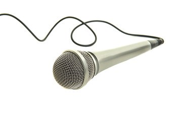 Microphone with black cord lying down isolated on a white background