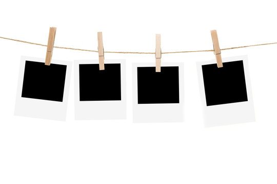 Clothesline with empty picture frames and clothespins isolated on a white background
