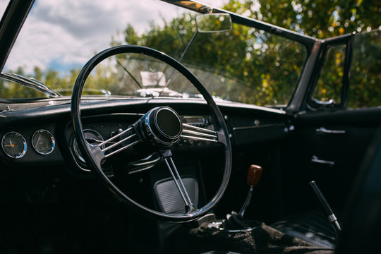 Classic car steering wheel and dashboard