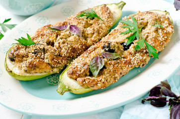 Baked zucchini stuffed with cheese and black olives