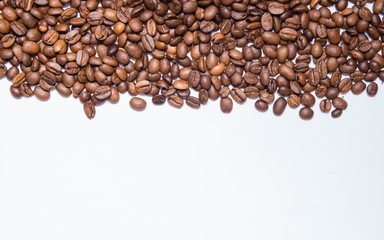 Coffee beans shot close up with a macro lens on a white background  © Dima