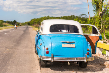 American retro car on the road, Vinales, Pinar del Rio, Cuba. Copy space for text.
