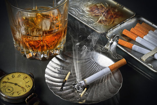 Still life with a whisky glass and cigarettes in a retro style