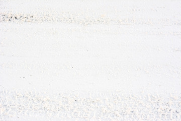 Road in winter, texture of snow and track of tyres
