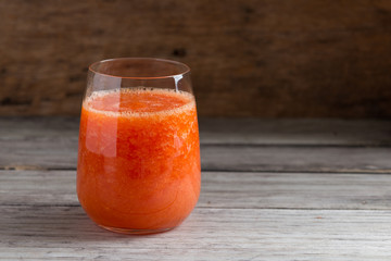 Fresh papaya smoothie juice in glass