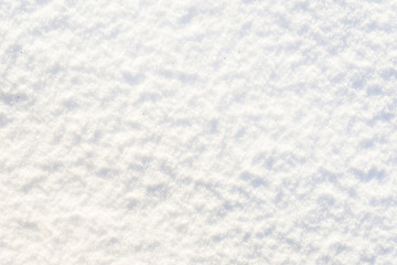 White texture of snow, shiny snowflakes smooth surface, winter background