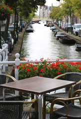 alfresco table of a bar and canal