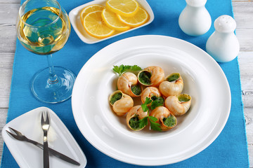 portion of Snails with herbs, butter