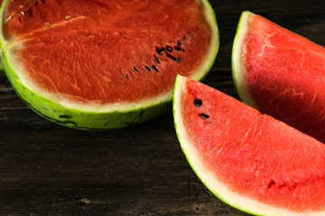 the watermelon on a rustic wooden table background