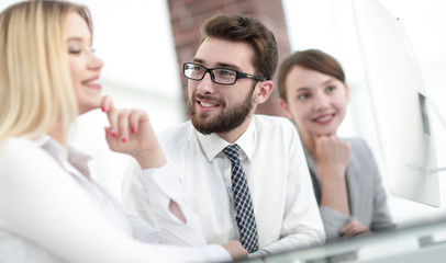 business team talking while sitting at your Desk.