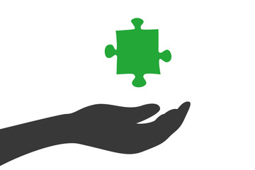 Hand hält Puzzleteil