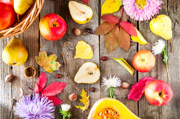 Harvest or Thanksgiving background with autumnal fruits, flowers, leaves, pumpkin, nuts and berries...