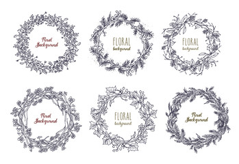 Collection of elegant hand drawn wreaths or circular garlands made of intertwined flowers, branches and leaves. Decorative floral elements isolated on white background. Monochrome vector illustration.