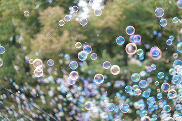 A lot of flying soap bubbles on a city holiday