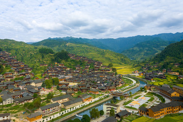 Fototapeta na wymiar Xijiang Miao Village Houses Mountains River View