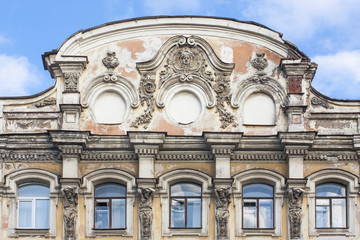 Old baroque building facade with elements of roof and windows. 