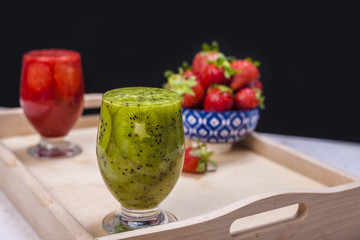Smoothies and fresh fruits on the table