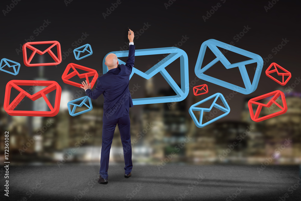 Poster businessman in front of a wall with approved email and spam message displayed on a futuristic interf