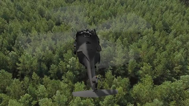 
 Black Hawk military Helicopter in flight over green pine tree forest in european - top view - aerial view