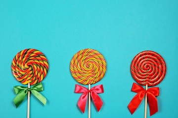 Three lollipops on blue background