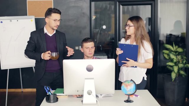 Group of young business people working together in creative office