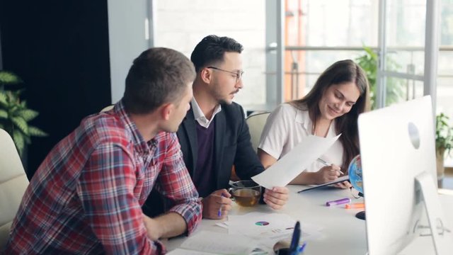 Group of young business people working together in creative office