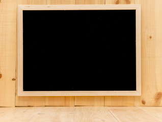 Abstract chalk blackboard with wood border frame on pine wood wall , ready used as background for add text or graphic