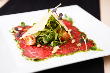 Beef carpaccio with salad