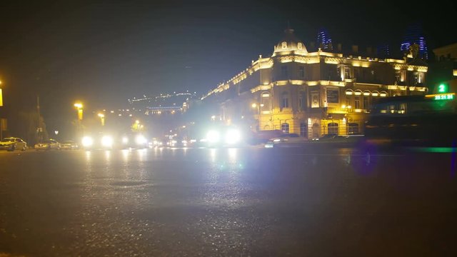 AZERBAIJAN, BAKU, MAY 9, 2017: Night Traffic in the City. Cars Drive with Lights on Night Road. Time Lapse. Night Traffic of Cars in the City. Timelapse.