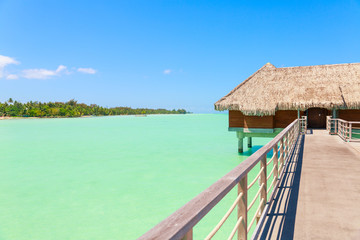 Traditional over water villa on a tropical lagoon of Bora Bora Island, Tahiti, French Polynesia