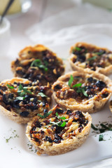 Snacks with mushrooms, cheese and olives