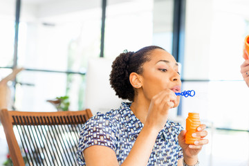 Portrait of smiling afro-american office worker sitting in offfice