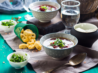 Beetroot soup served in bowls on napkin. Lunch with light vegetarian dish