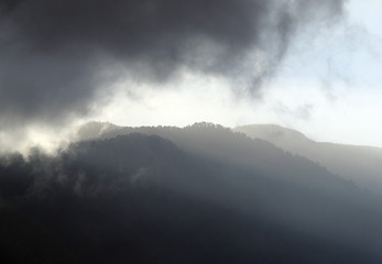 mountains with dramatic storm clouds with shadows in tenerife