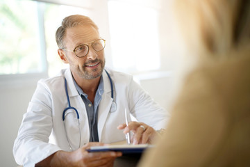 Doctor with patient in medical office - 172382693