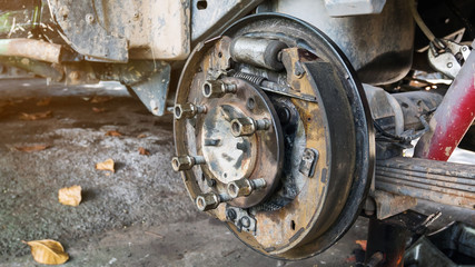 Fototapeta premium Old and rusty car's suspension, which removes the wheels for repair, replacement and change news parts -Automotive industry and garage concepts.