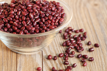 Red beans in a glass bowl on the table.