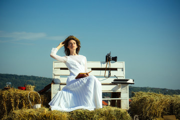 Woman reading book on blue sky