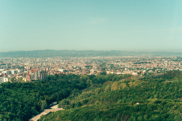Aerial view to Tirana countryside old and new buildings. View from mountain Dajti.