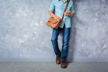 Vintage men clothings retro style with low key lighting over loft concrete wall background.