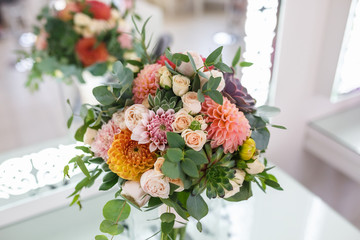 bright wedding bouquet of summer dahlias and roses