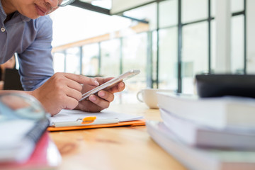 Asian business man using mobile application.