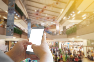  hand holding phone shopping mall