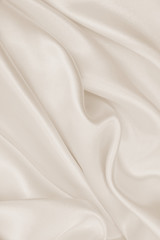 Smooth elegant golden silk or satin luxury cloth texture as wedding background. Luxurious background design. In Sepia toned. Retro style