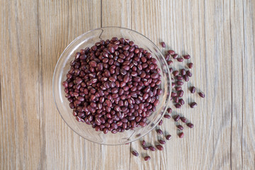 High angle view of red beans in a glass bowl on the table.