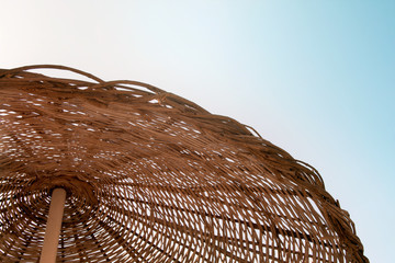 Wicker texture against the blue sky