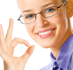 Businesswoman with okay gesture, on white