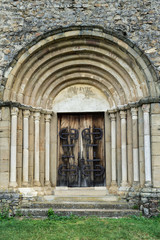 Fototapeta na wymiar Main door of Cisnadioara fortified church, medieval fortress on the hill near Sibiu, Transylvania, Romania