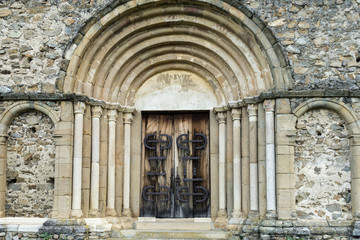 Main door of Cisnadioara fortified church, medieval fortress on the hill near Sibiu, Transylvania, Romania